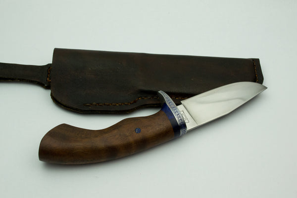 Small utility knife with wrought iron guard and walnut handle