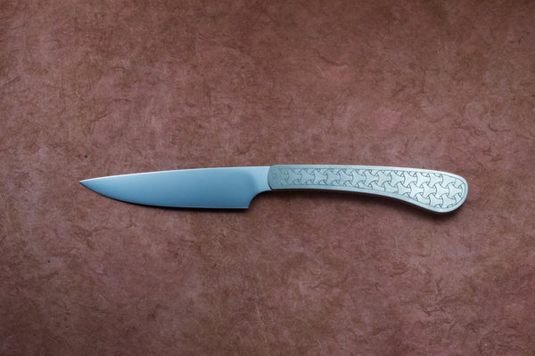 Medium utility knife with engraved titanium handle